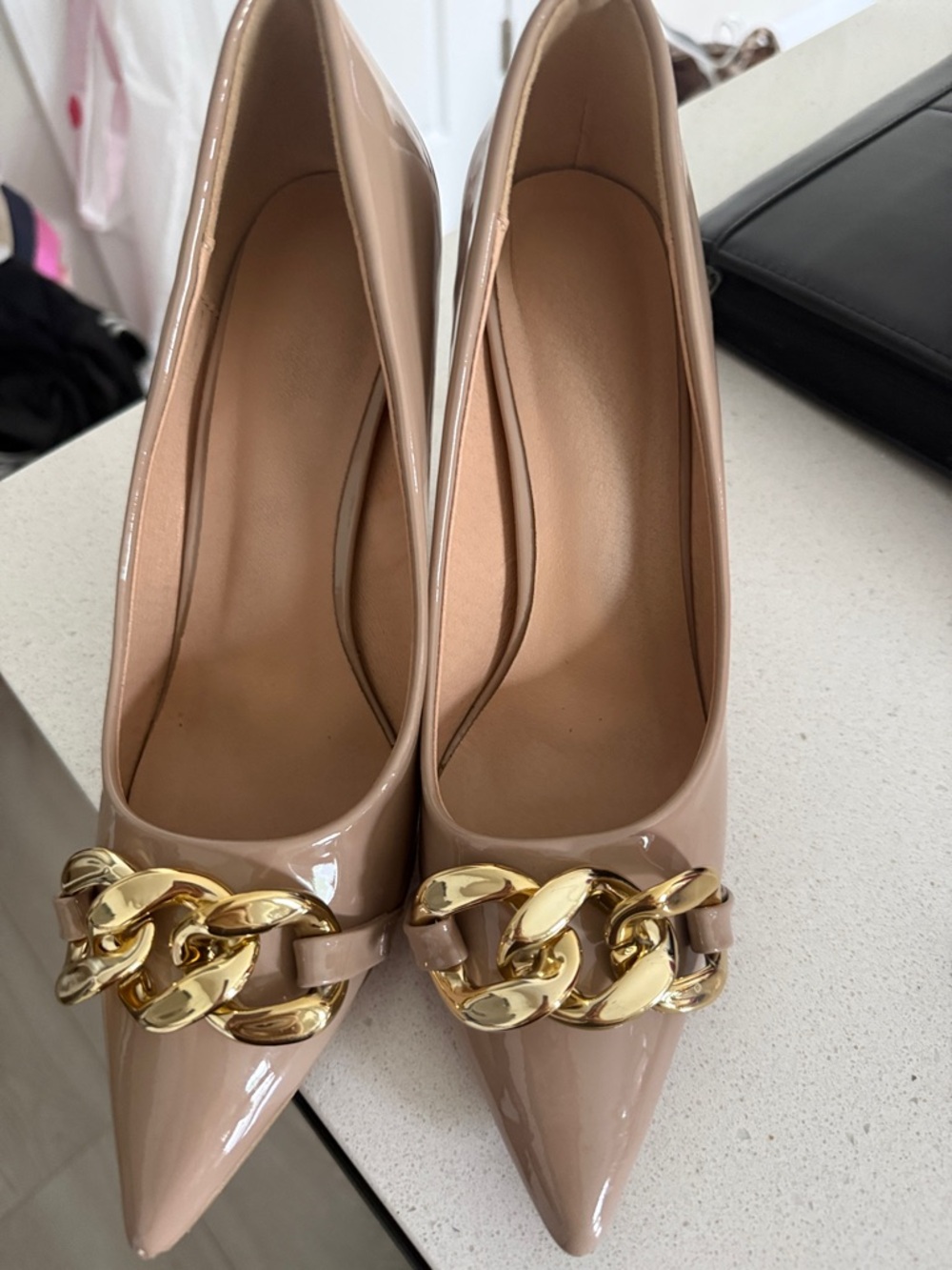 Nude Patent Pointed-Toe Pumps with Gold Chain Accent